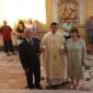 C4 Parents lead their son to celebrate Mass