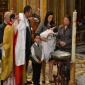 28 Celebrant exhibits white robe sign of purity