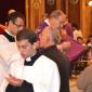 111 Daniel's father receives Holy Communion from his son