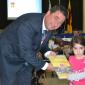 DSC_0437 Mayor presents books to a Kinder student