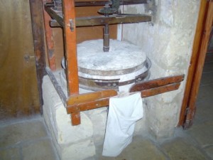13 - a small grinding mill used for grinding dried broad beans